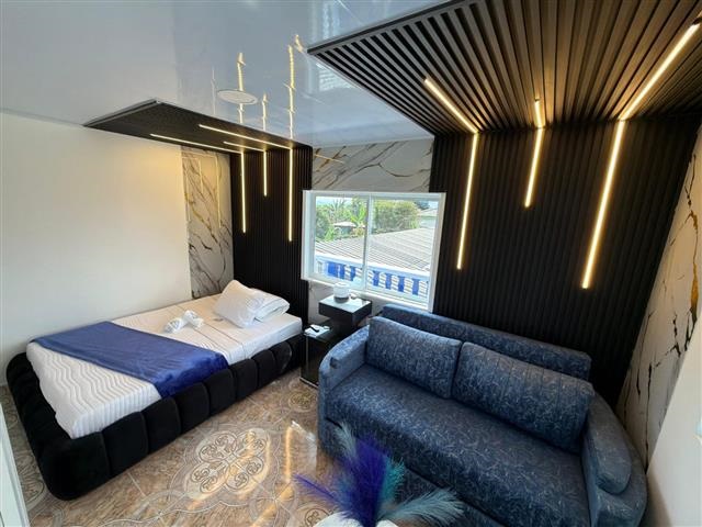artehoteldelquindio19 Alquiler Fincas Quindio Hoteles Eje Cafetero Planes Transporte habiración con cama doble y sofa para 2 personas