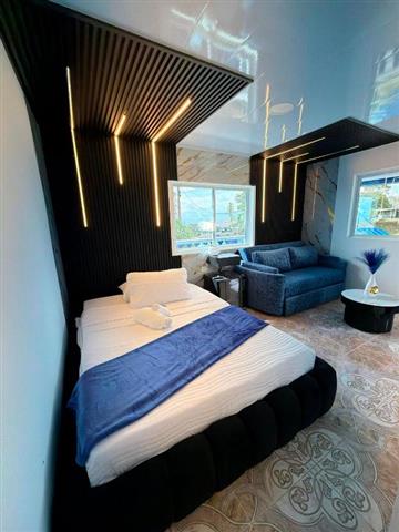 artehoteldelquindio9 Alquiler Fincas Quindio Hoteles Eje Cafetero Planes Transporte habiración con cama doble y sofa para 2 personas
